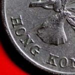 Latest Hong Kong dollar falls to 10-month low against US dollar, testing its famous peg